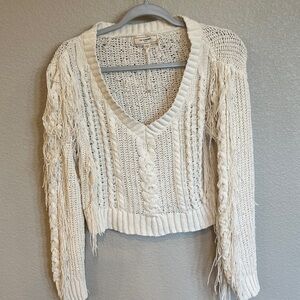 Chic Ivory V-Neck Sweater with Fringe Details